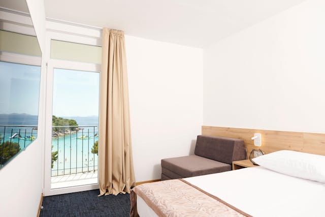 Family room with sea view and balcony